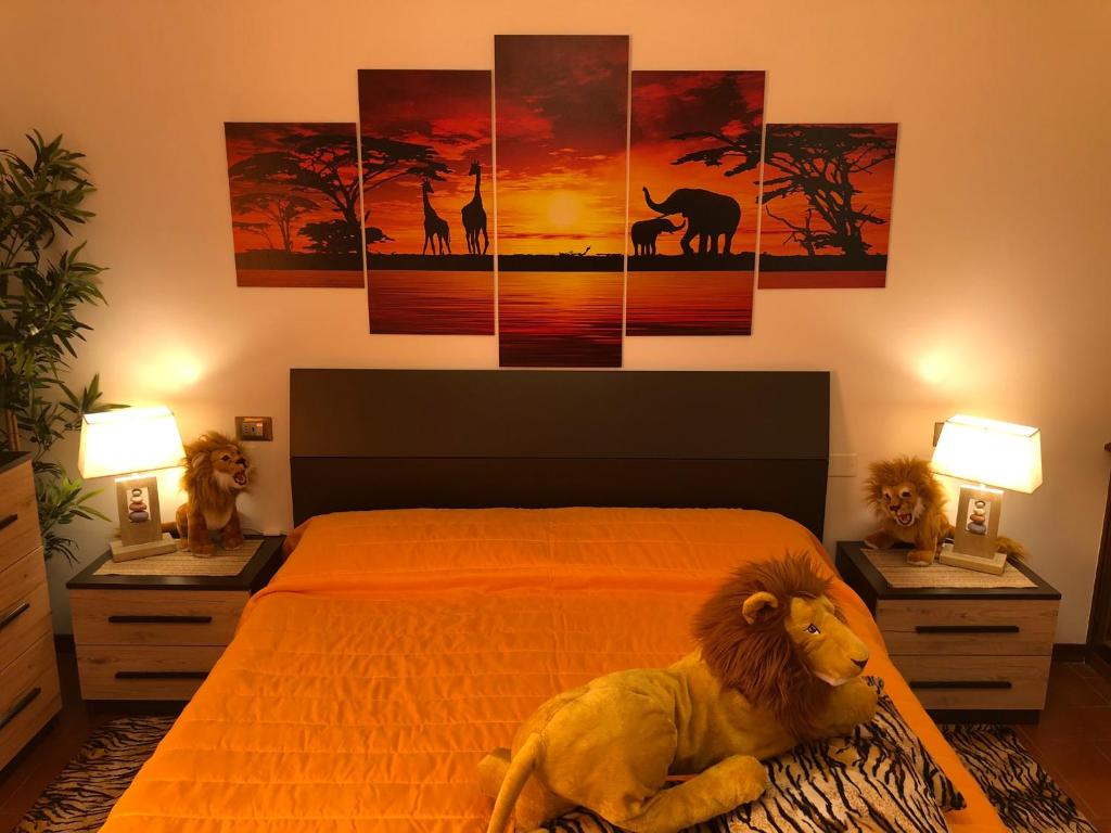 a bedroom with a lion laying on a bed at Jenny's Country Dreamhouse in Arezzo