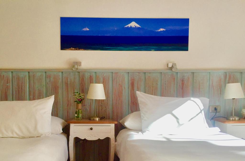 Postel nebo postele na pokoji v ubytování Hotel Frutillar