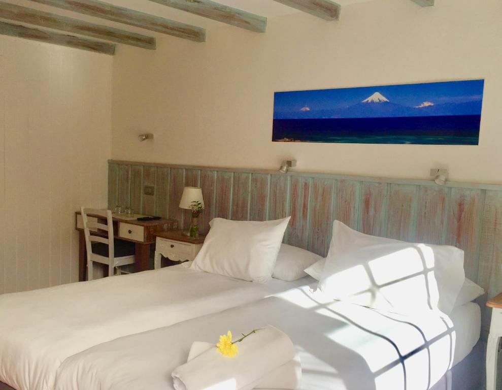 Postel nebo postele na pokoji v ubytování Hotel Frutillar