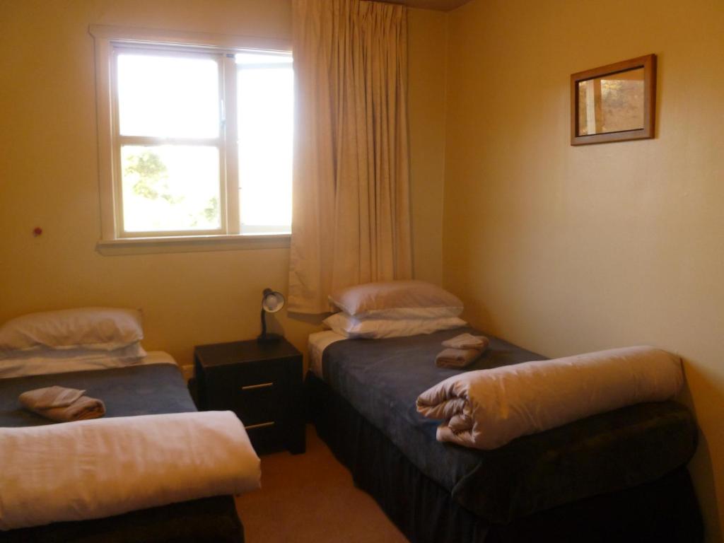 Postel nebo postele na pokoji v ubytování Kaniere Hotel
