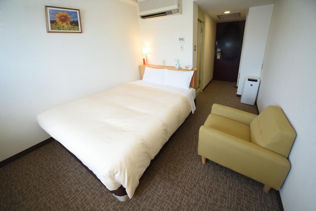 Postel nebo postele na pokoji v ubytování Hotel Route Tsukuba