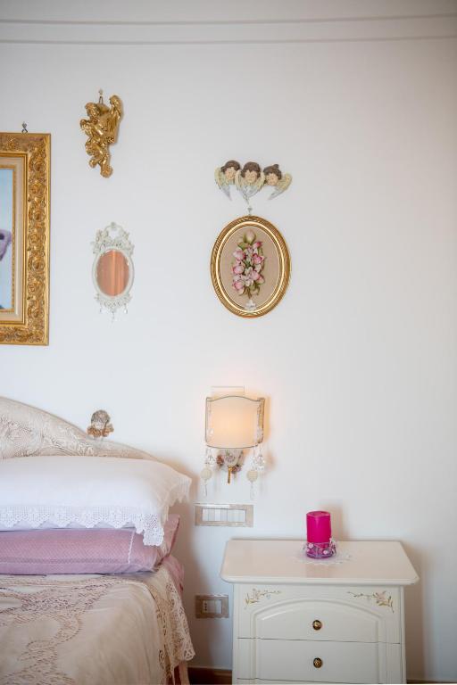 Posteľ alebo postele v izbe v ubytovaní CASA PERLA
