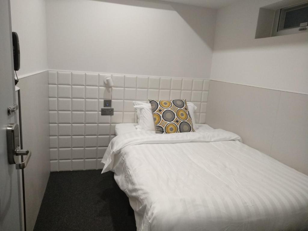 A bed or beds in a room at MK STAY - formerly HOTEL MK