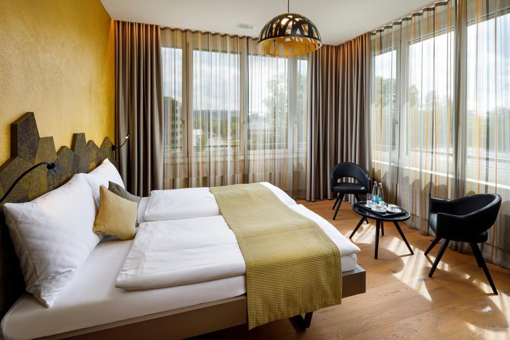 Postel nebo postele na pokoji v ubytování Focus Hotel