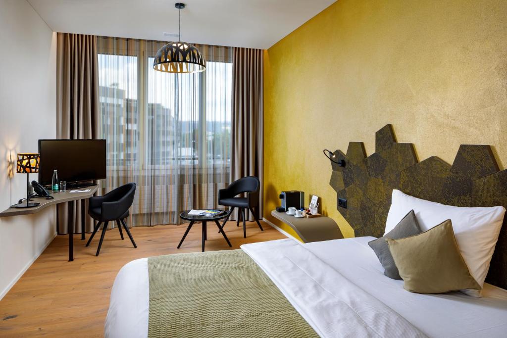 Postel nebo postele na pokoji v ubytování Focus Hotel