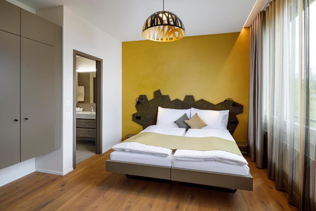 Postel nebo postele na pokoji v ubytování Focus Hotel
