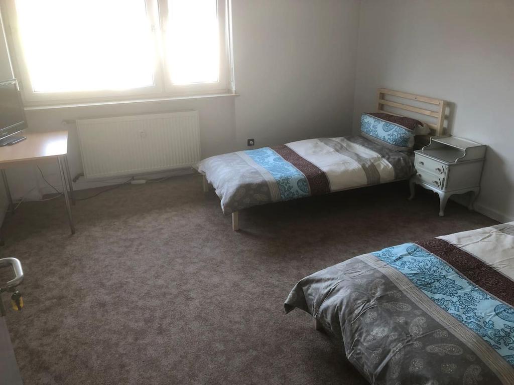 Кровать или кровати в номере Mühlwegunterkunft