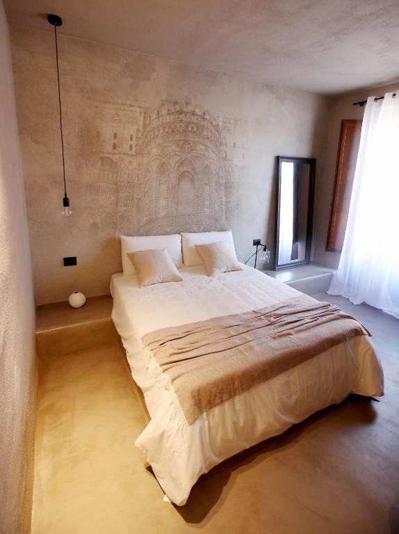 Postel nebo postele na pokoji v ubytování Casa Nostra Luxury Suites & Spa