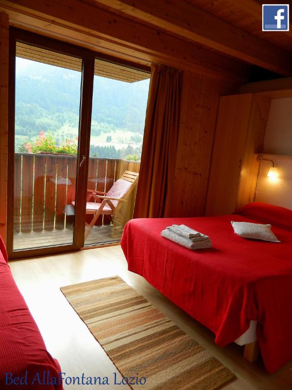 Postel nebo postele na pokoji v ubytování B&B Alla Fontana