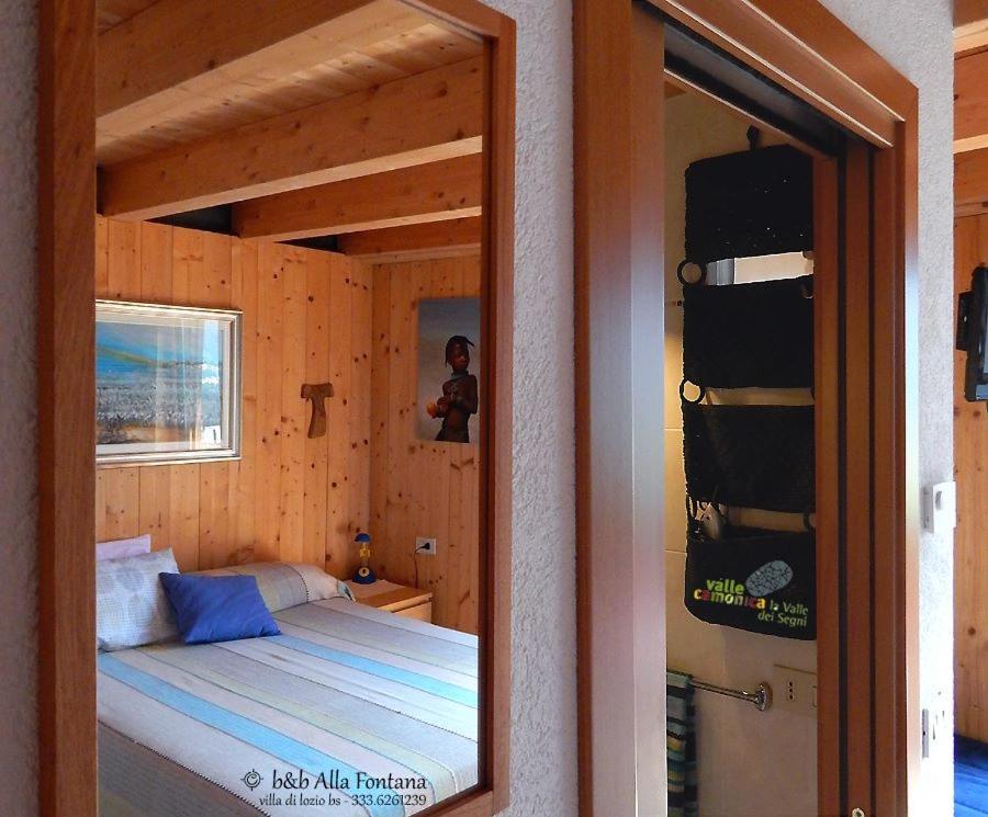 Postel nebo postele na pokoji v ubytování B&B Alla Fontana