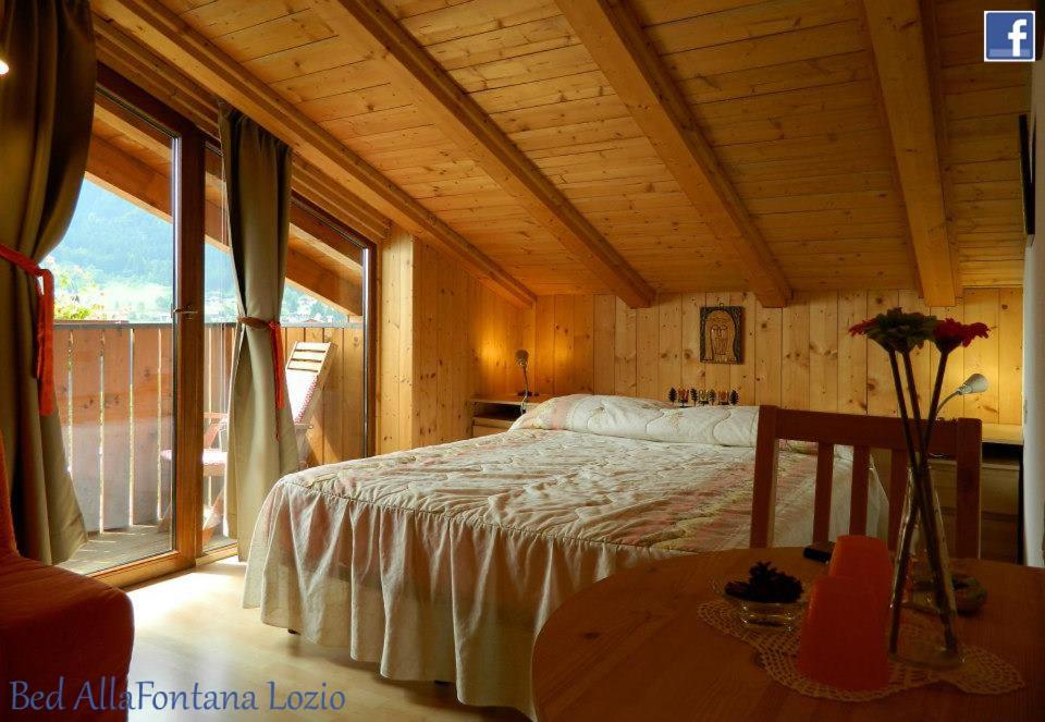 Postel nebo postele na pokoji v ubytování B&B Alla Fontana