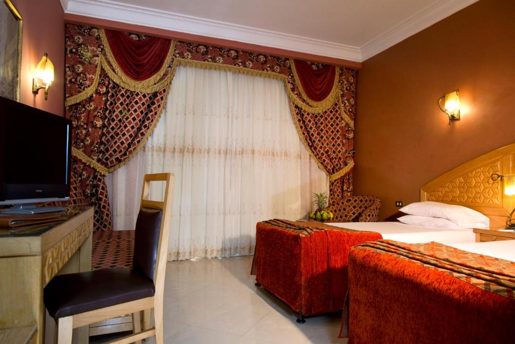 Postel nebo postele na pokoji v ubytování Oriental Rivoli Hotel & Spa