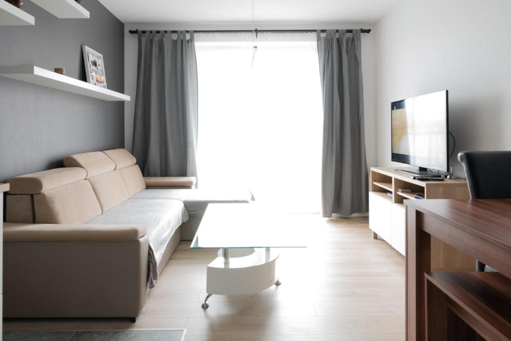 Televízia a/alebo spoločenská miestnosť v ubytovaní Republiki Korczakowskiej Ferienwohnung