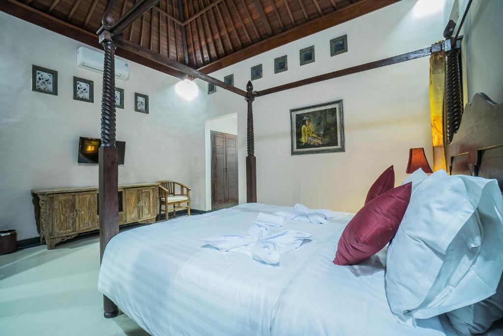 Postel nebo postele na pokoji v ubytování Jero Griya Ubud