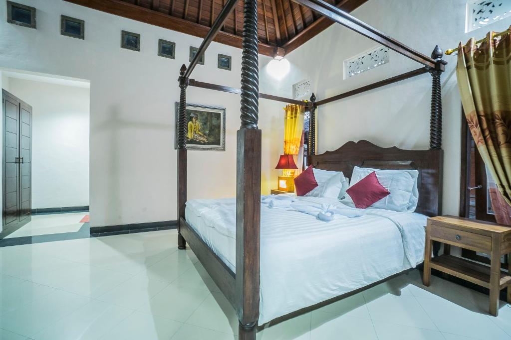 Postel nebo postele na pokoji v ubytování Jero Griya Ubud