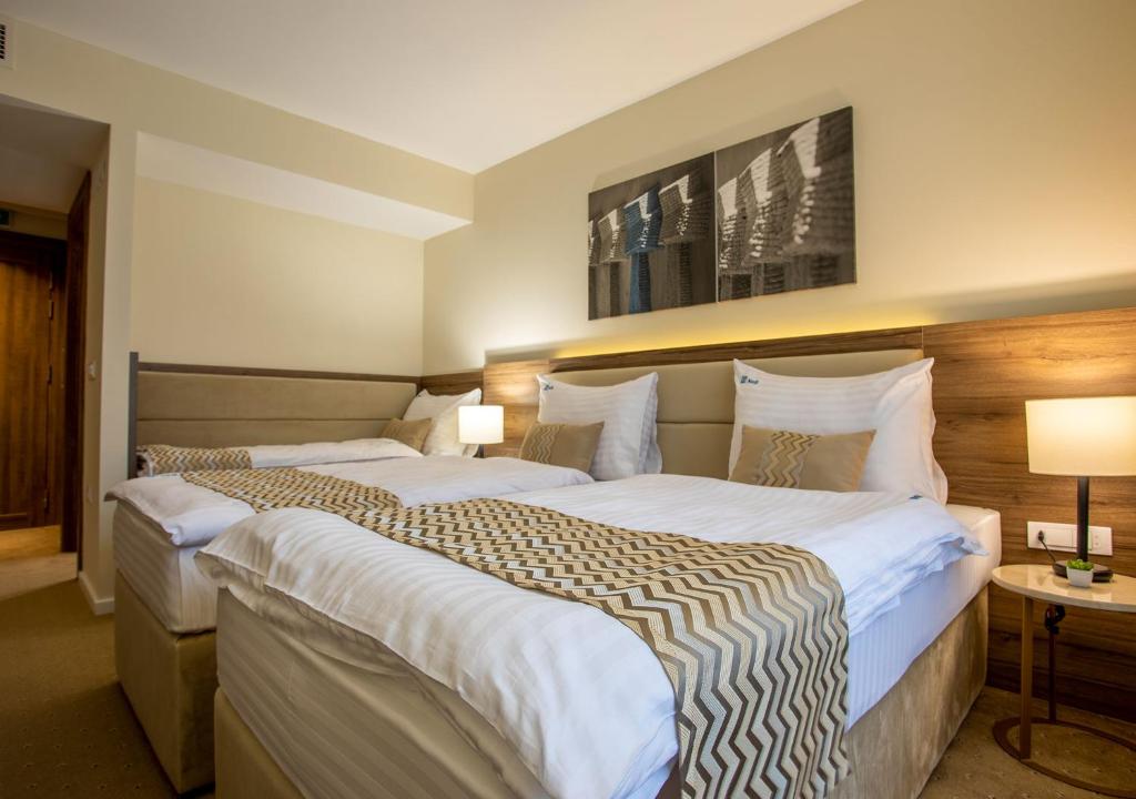 Postel nebo postele na pokoji v ubytování Hotel Nais