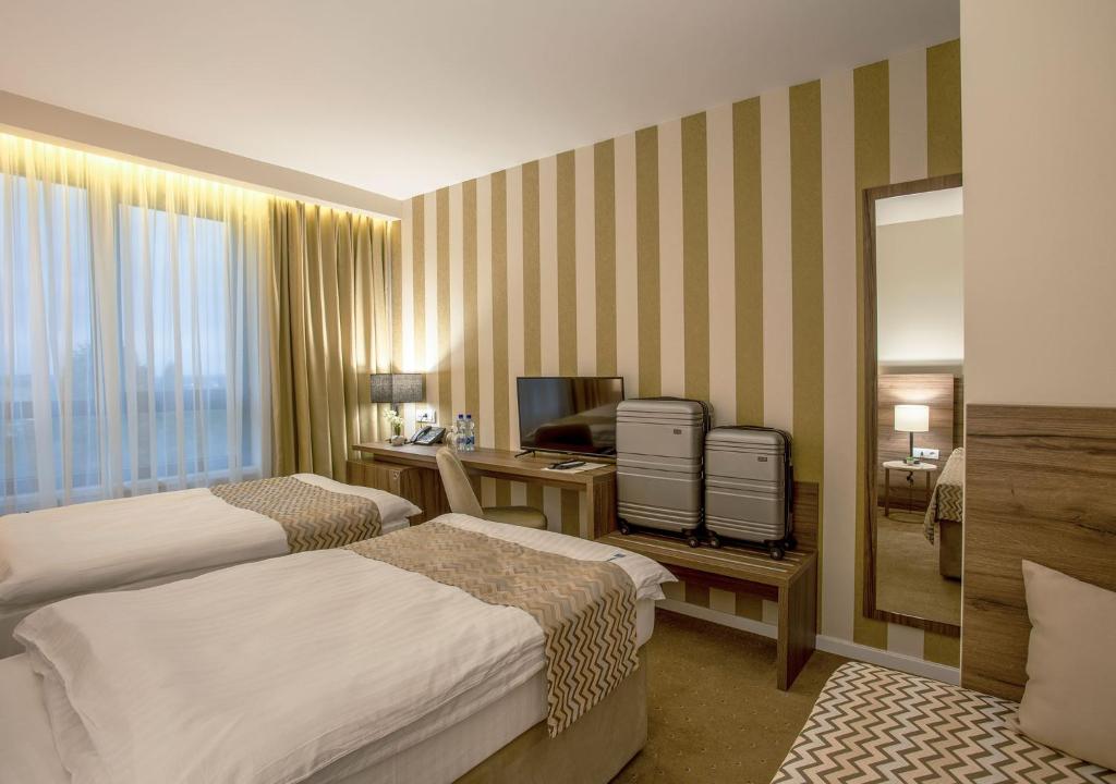 Postel nebo postele na pokoji v ubytování Hotel Nais