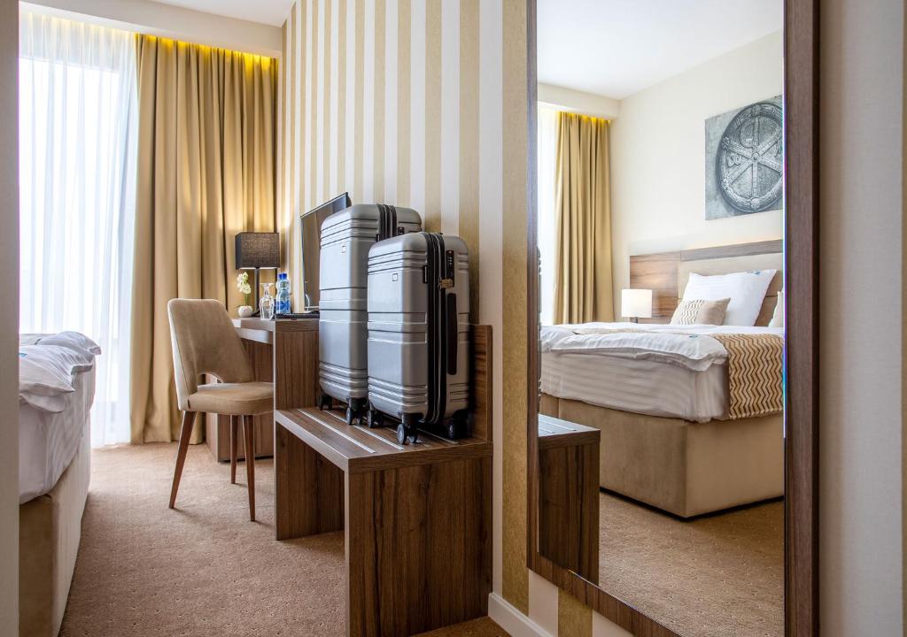 Postel nebo postele na pokoji v ubytování Hotel Nais
