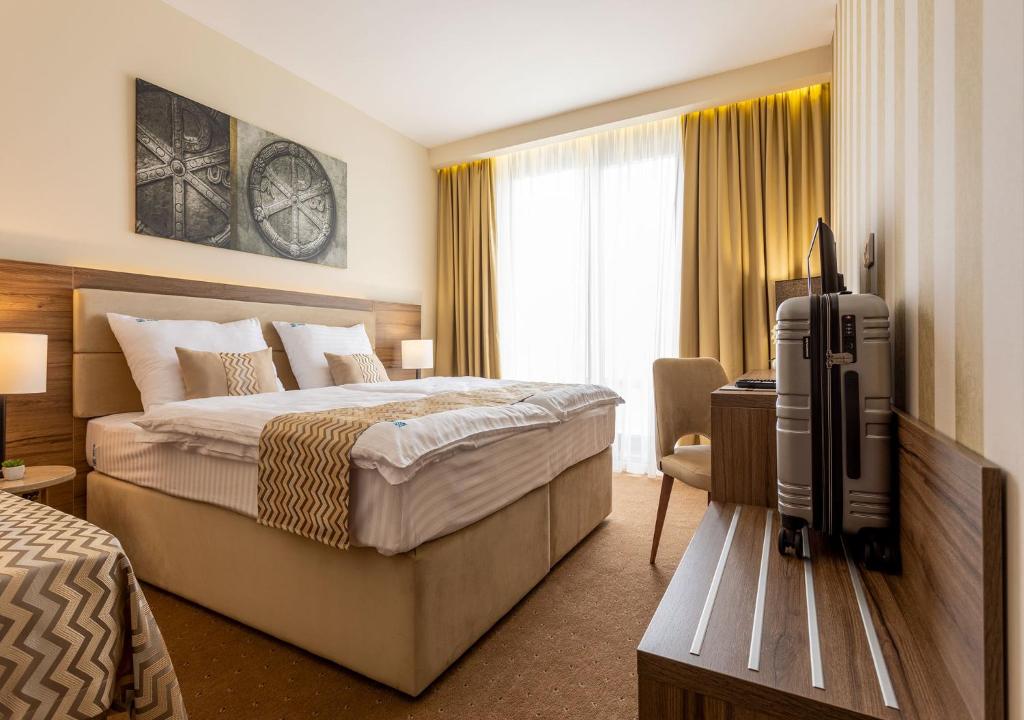 Postel nebo postele na pokoji v ubytování Hotel Nais