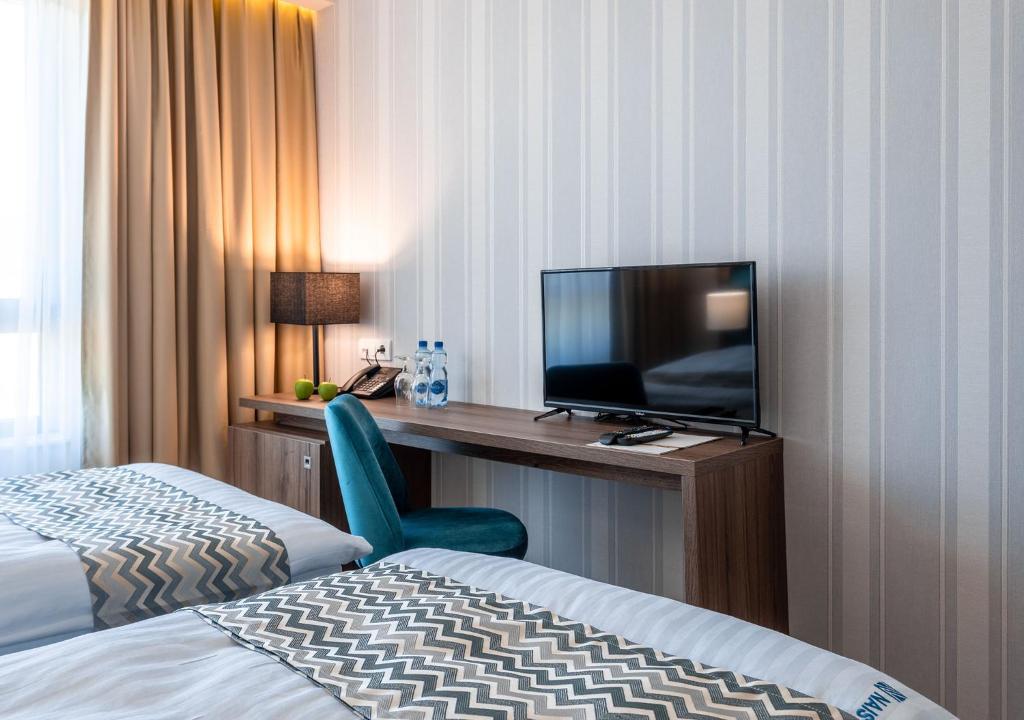 TV a/nebo společenská místnost v ubytování Hotel Nais