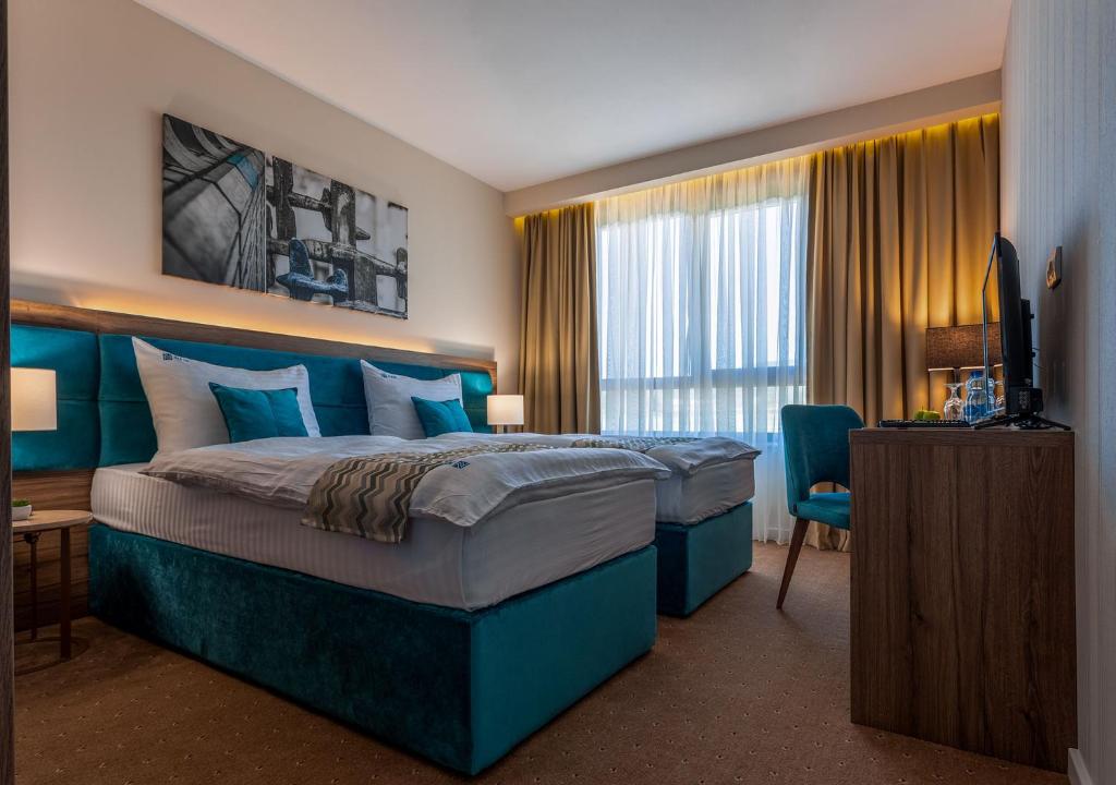 Postel nebo postele na pokoji v ubytování Hotel Nais