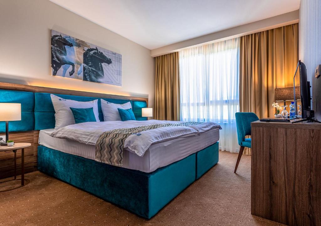 Postel nebo postele na pokoji v ubytování Hotel Nais