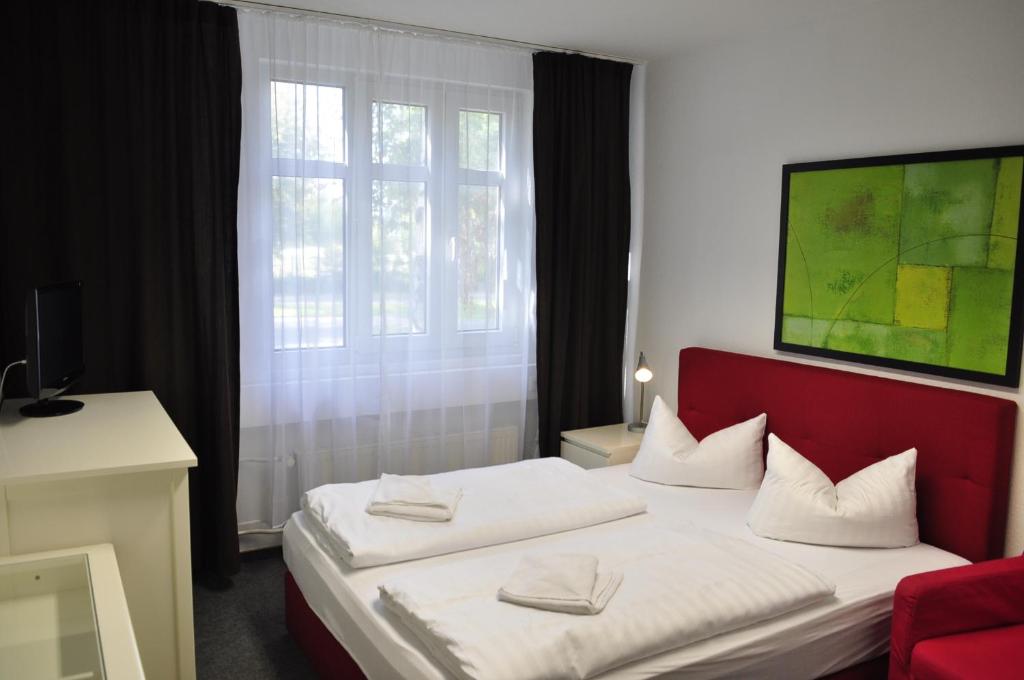 Postel nebo postele na pokoji v ubytování Apart Hotel Ferdinand Berlin