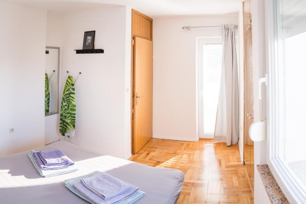 Postel nebo postele na pokoji v ubytování Apartment by Jassi