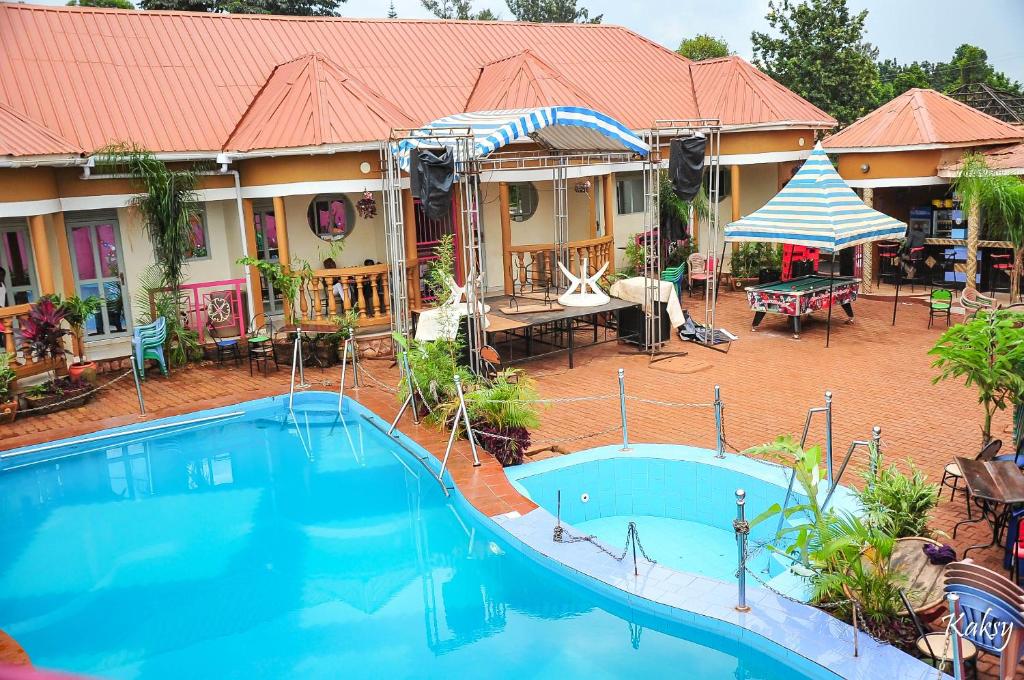 an overhead view of a swimming pool in front of a house at Dreamz Recreation Center in Jinja