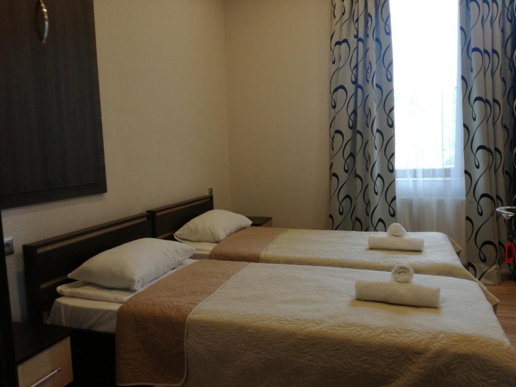 Postel nebo postele na pokoji v ubytování Guest House Kakheti