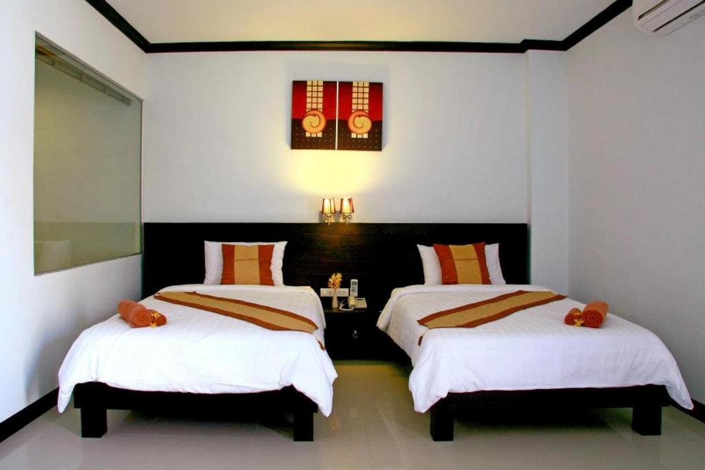 Postel nebo postele na pokoji v ubytování Tanawit Hotel & Spa