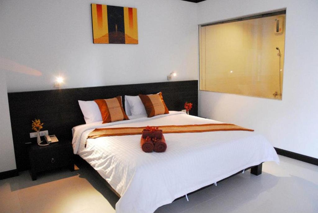 Postel nebo postele na pokoji v ubytování Tanawit Hotel & Spa