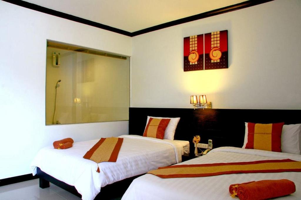 Postel nebo postele na pokoji v ubytování Tanawit Hotel & Spa