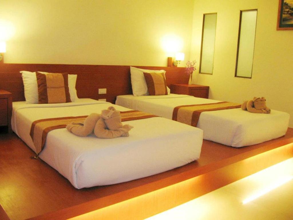 Postel nebo postele na pokoji v ubytování Tanawit Hotel & Spa