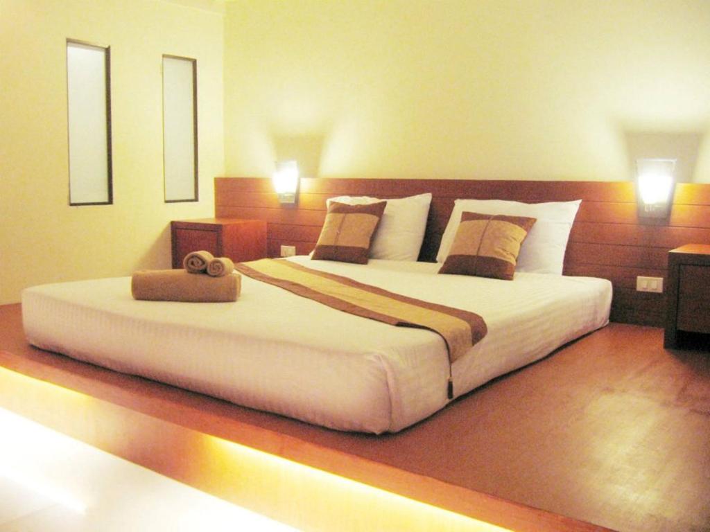 Postel nebo postele na pokoji v ubytování Tanawit Hotel & Spa