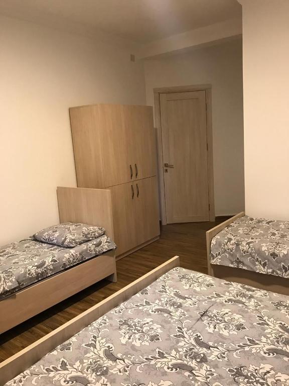 Postel nebo postele na pokoji v ubytování Hotel Nino Ureki