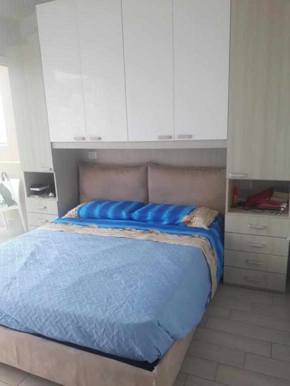 A bed or beds in a room at Barbara's house - Sardinia