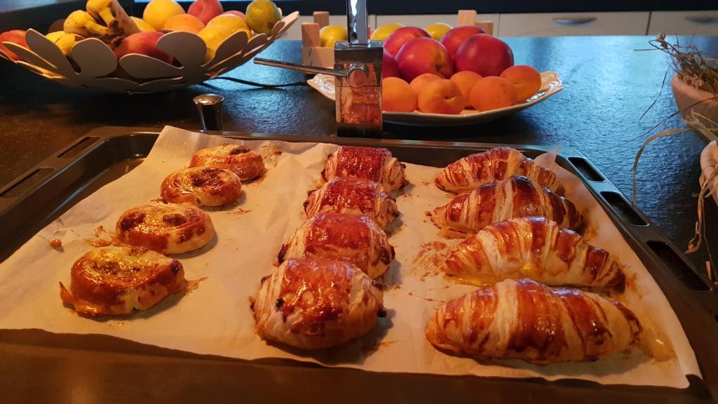 a tray of food on a table with fruit at Maison d hotes Lapitxuri in Arcangues