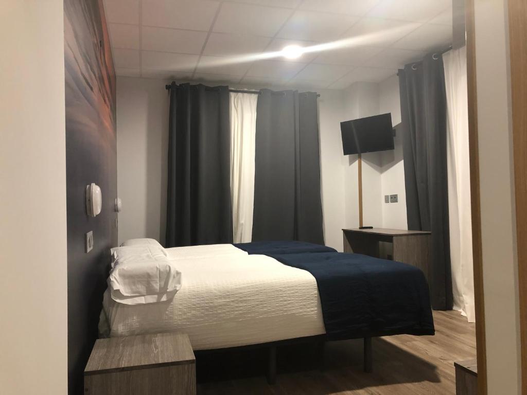 Postel nebo postele na pokoji v ubytování Hostel El Paloma