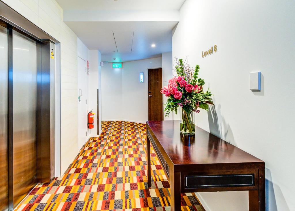 Postel nebo postele na pokoji v ubytování VR Queen Street Hotel & Suites
