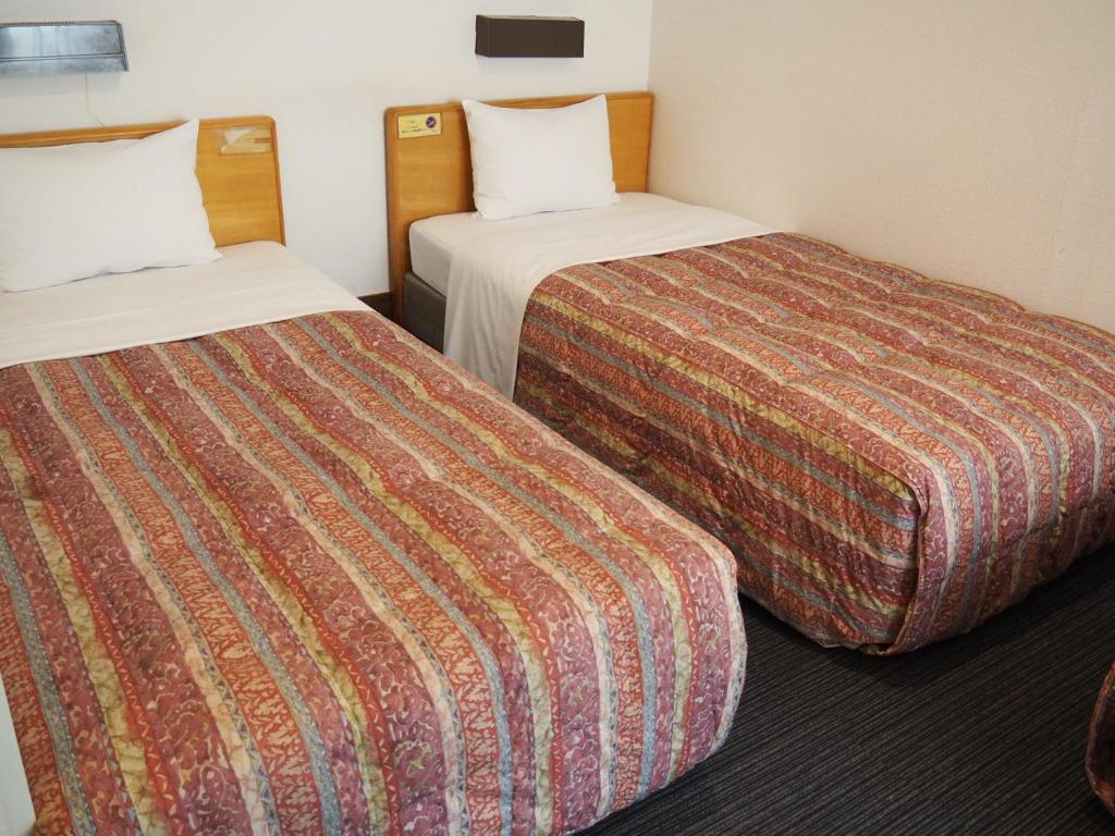 Habitación de hotel con 2 camas contiguas en Hotel Tetora Ikebukuro, en Tokio
