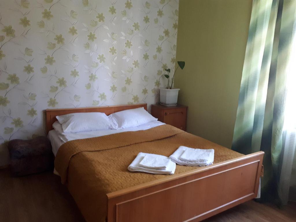 Postel nebo postele na pokoji v ubytování Hotel Gostynnyi Dvir