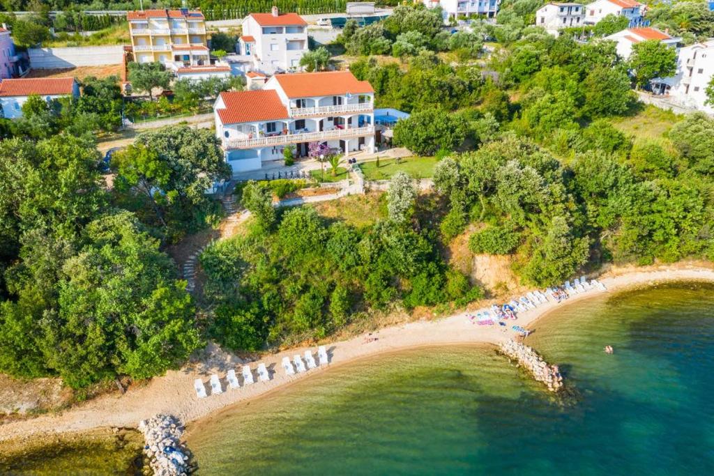 an aerial view of a beach with a resort at Apartmani Lovre Posedarje in Posedarje