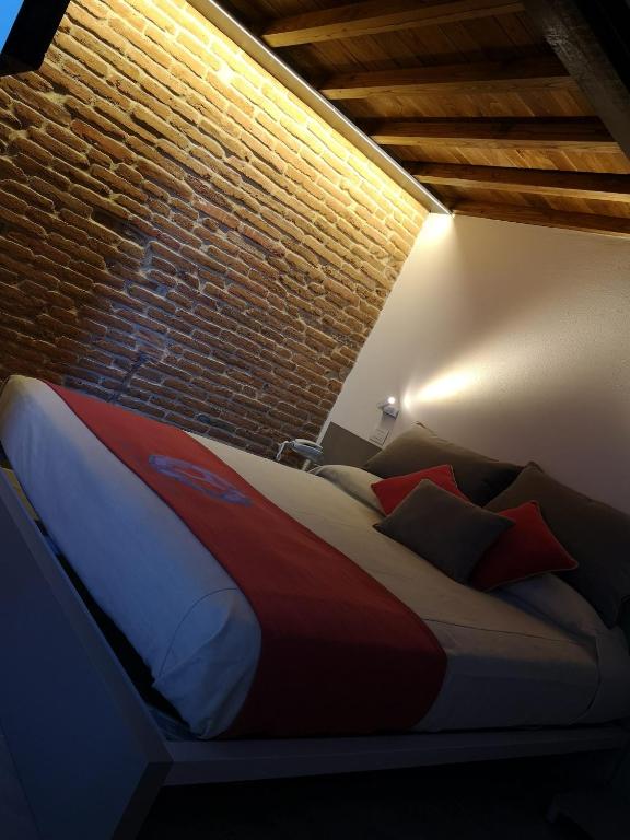 Postel nebo postele na pokoji v ubytování L'Ospitale dei Brilli