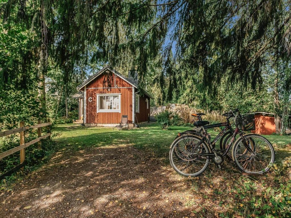 a couple of bikes parked in front of a cabin at Holiday Home C by Interhome in Porvoo