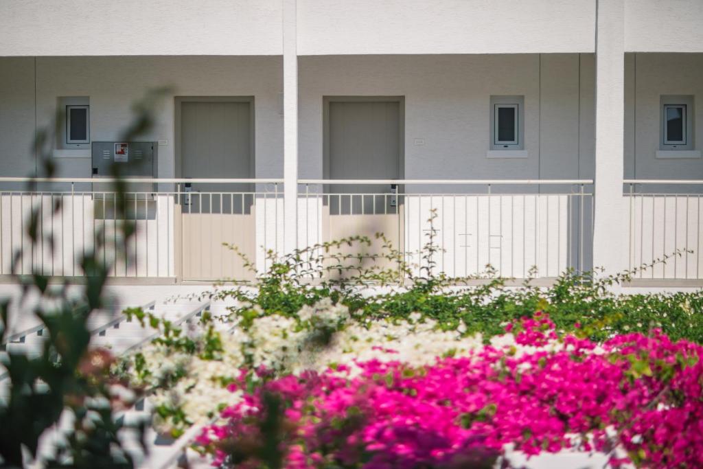 a building with pink flowers in front of it at Nissi Park Hotel in Ayia Napa