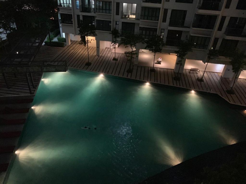 an overhead view of a swimming pool at night at MSI Cozy Homestay in Seri Kembangan