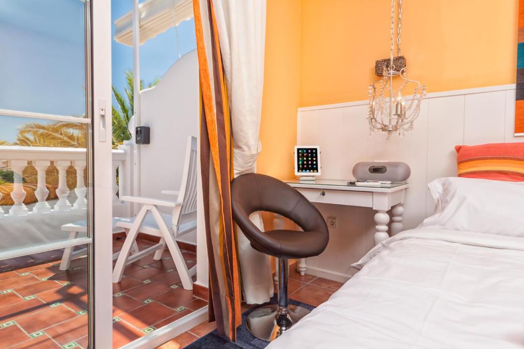 Postel nebo postele na pokoji v ubytování Boutique Hotel Pueblo