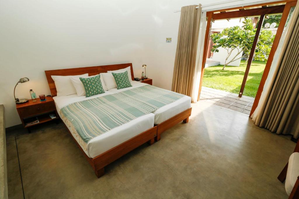 Postel nebo postele na pokoji v ubytování Ubuntu Beach Villas by Reveal