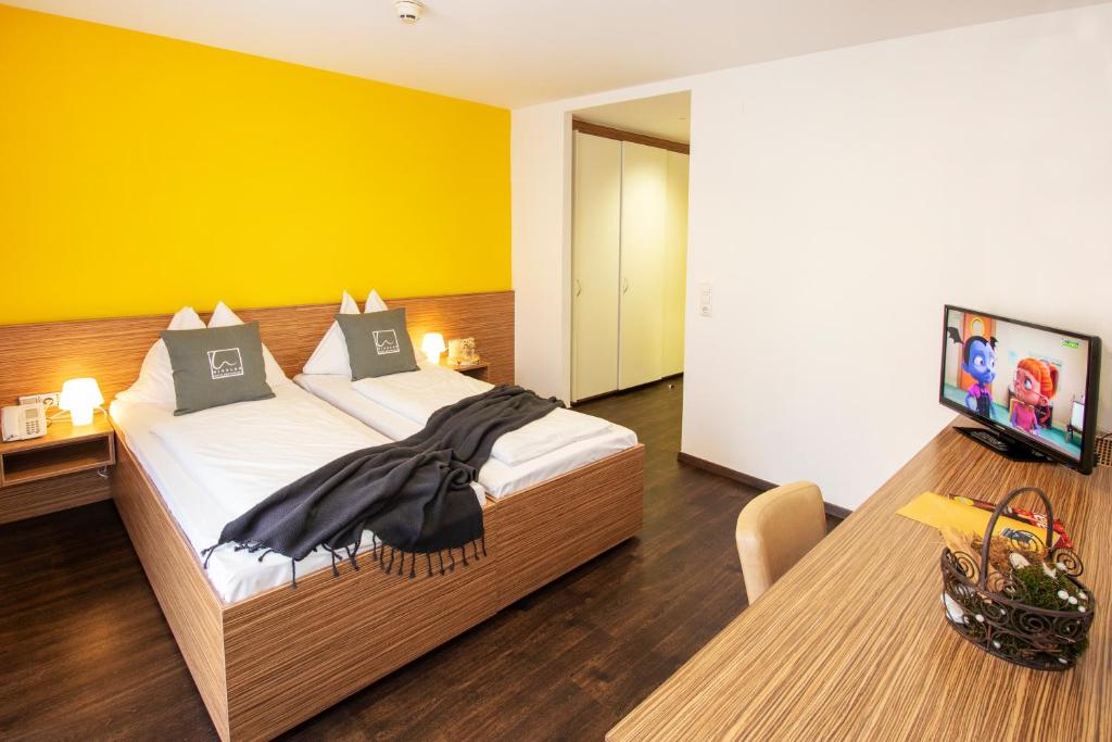 Postel nebo postele na pokoji v ubytování Hotel Restaurant Winkler